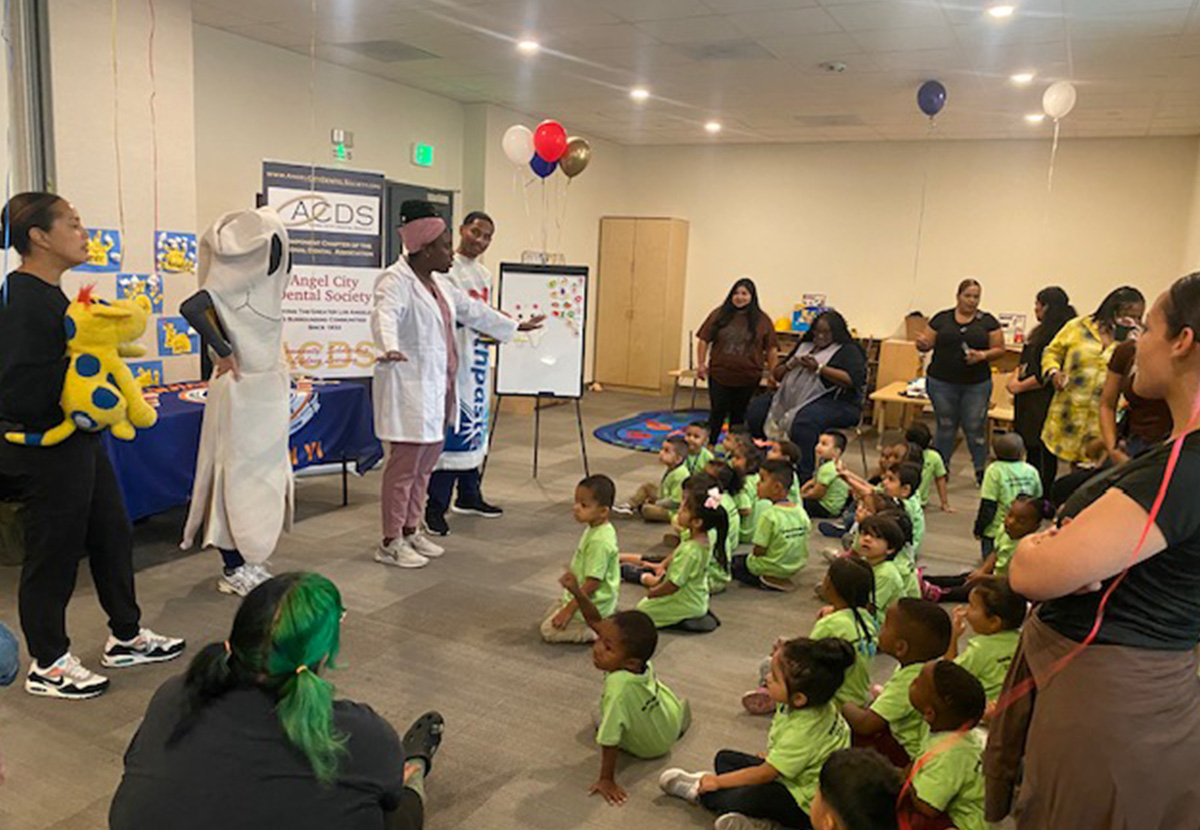 Mia Harrison speaking with children in a presentation